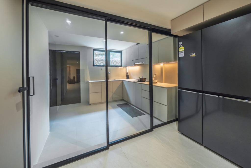 59 Wan Toh Ave Glass door separating the dry & wet kitchen + laundry